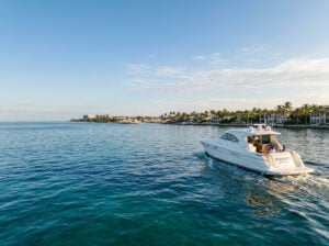 Boat cruising through calm waters near Boca Raton, Florida, during the fall boating season.